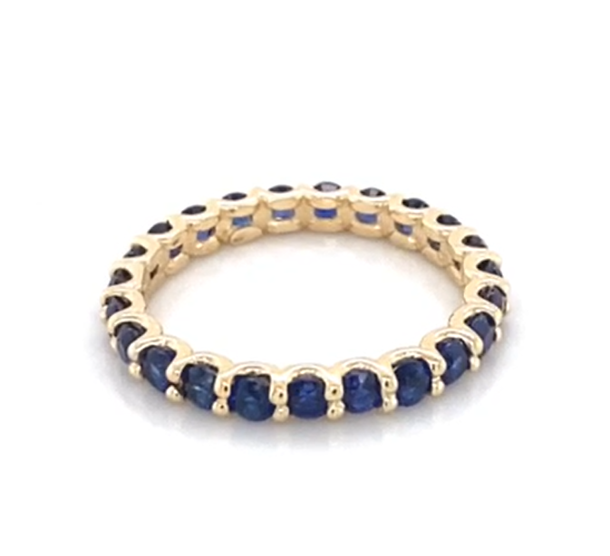 media.nlid22464c7914678h3AAADeWz3ykRWiWDTF337MfZ1lhq2ru4z2aTbicly-xL-KBm Yellow Gold Sapphire Band - Image 1